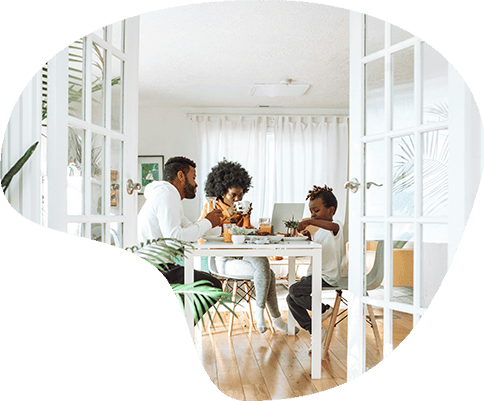 a family at a dining table eating