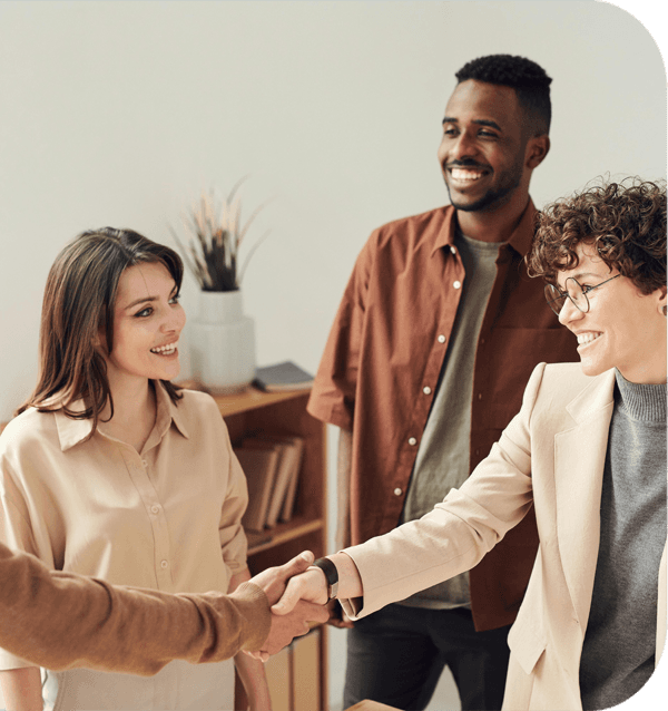 four people greeting each other